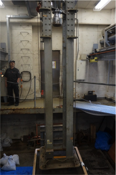 Photograph of the large-scale falling weight-type testing device1